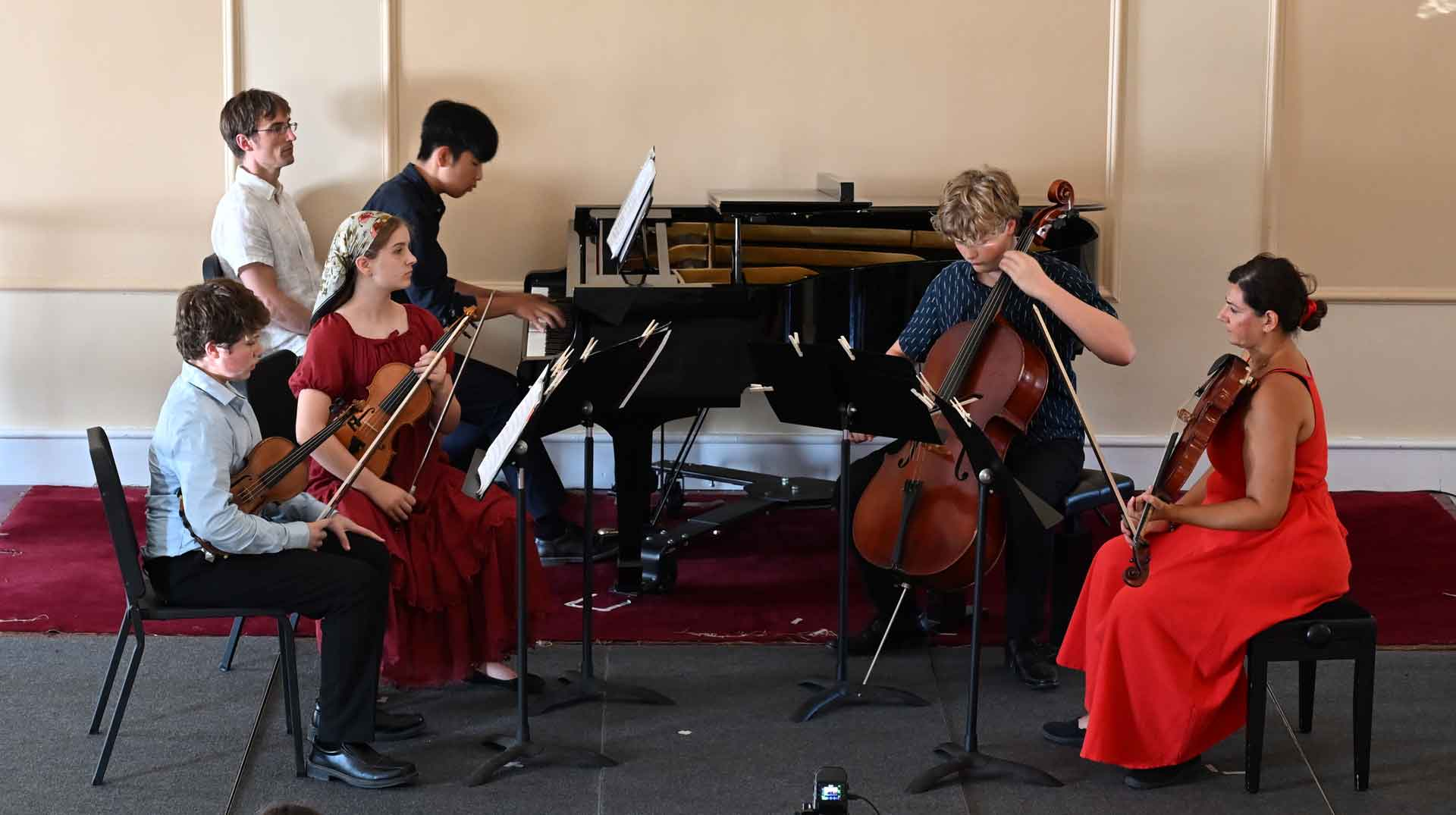 About Point CounterPoint Six musicians perform chamber music in true Point CounterPoint fashion; four string players are seated with their instruments as two pianists play a grand piano in the background.